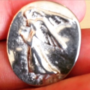 Upon returning to class this week, a student gave me this "pocket angel." She carried it around with her for the last four years as she battled leukemia. "I believe these things should be passed on to those who need them," she said. "You should carry this around with you until you're better, then pass it on to someone who needs it more." 